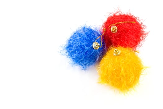 Fluffy christmas baubles on white background