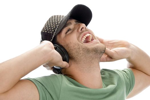 happy man enjoying music on an isolated white background