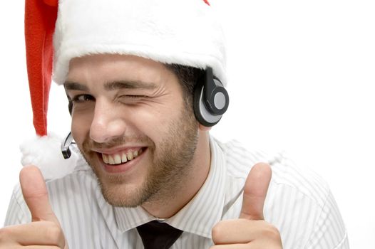 happy businessman posing with cheer up and wearing santa cap