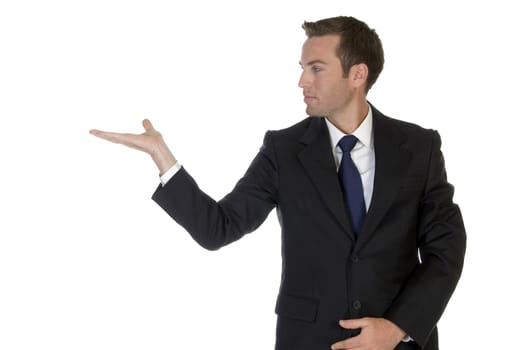 businessman looking his palm on an isolated background