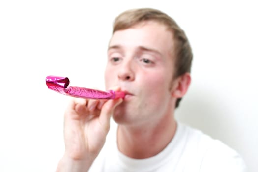 A person playing with party blowers