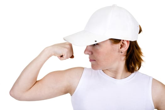 The strong girl in a cap on a white background