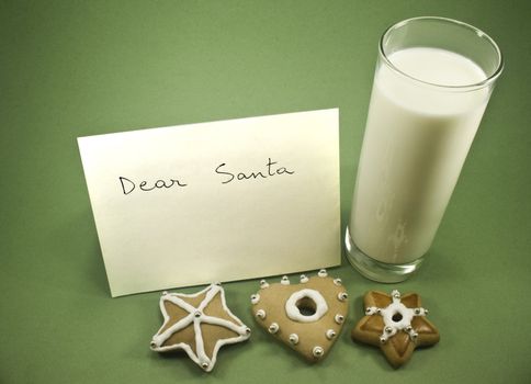 Three cookies with milk and letter to Santa