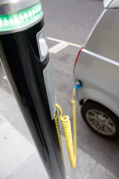 An electronic car chargingin the city