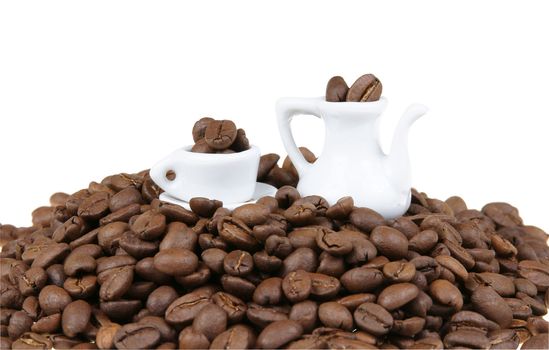 Stack of coffe beans with miniature coffee service