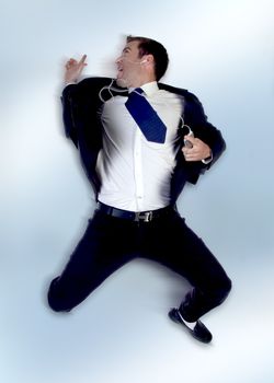 businessman jumping in the air on an abstract  background