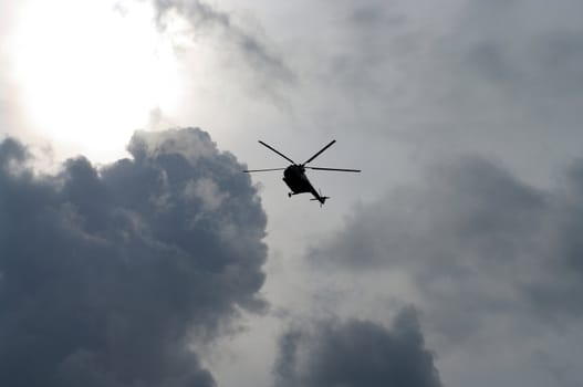 Helicopter on background of sky 