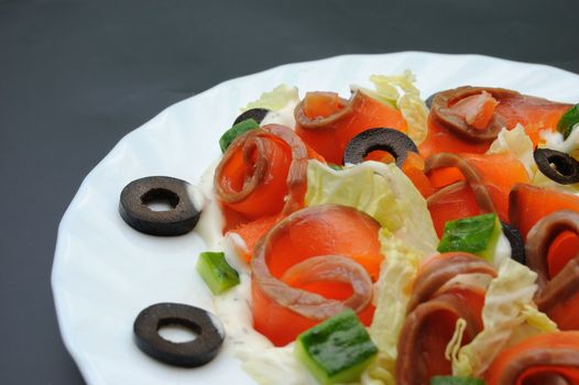 salmon salad on white plate