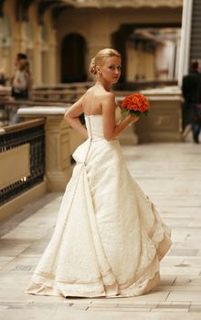 The beautiful bride with bouquet in an interior