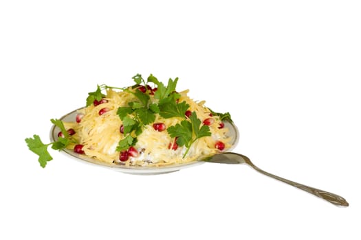 Salad dish with spoon and greens isolated in white