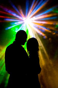 Romantic Dancer at the disco night club meeting Light rays