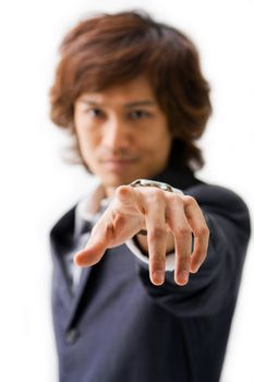 Business man in gray suit blurred with sharp hand and finger pointing at you, isolated