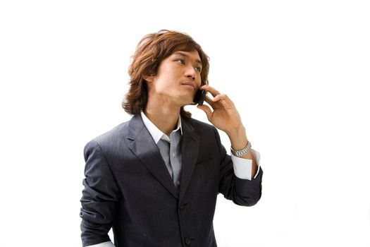 Young Asian business man with mobile phone calling, isolated