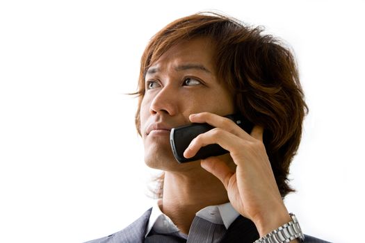 Young Asian business man with mobile phone calling, isolated