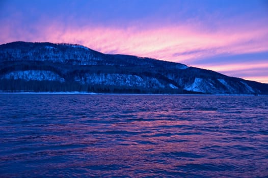 The river. A winter landscape. Ice, water. A river coast.