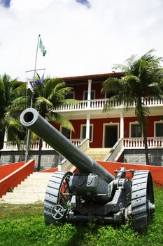 Fernando de Noronha's city hall. A red building with cannons.