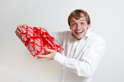 A man presenting a christmas present