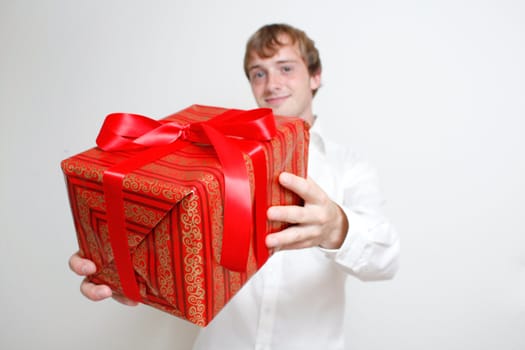 A man presenting a christmas present