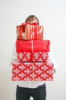 A man presenting several christmas presents