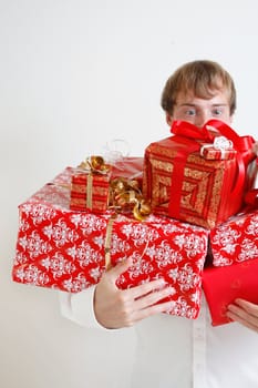 A man presenting several christmas presents