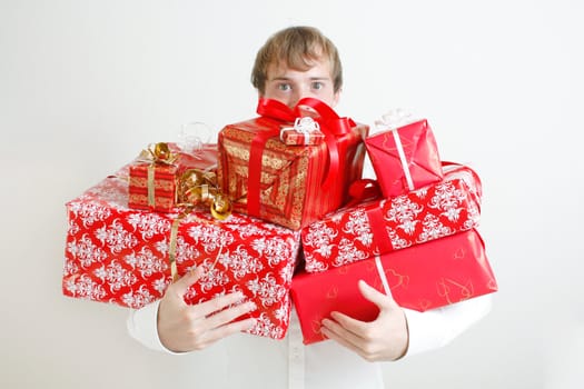 A man presenting several christmas presents