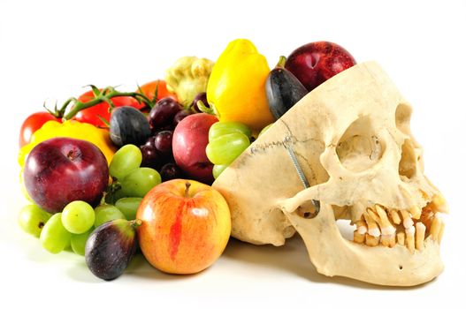 A human skull overflowing with fruits and vegetables, like a horn of plenty.