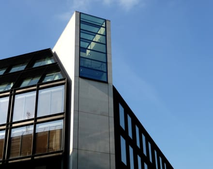 A photo of a modern styled office building.