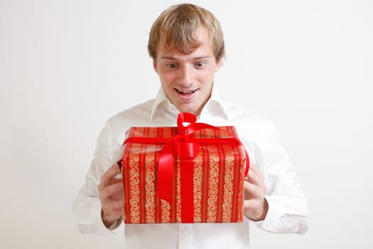 A man presenting a christmas present