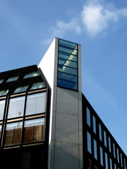 A photo of a modern styled office building.