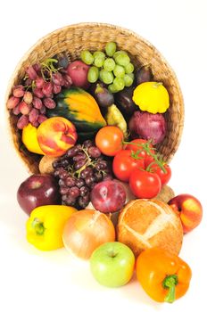 A rich bounty of autumn harvest foods spilling from a basket