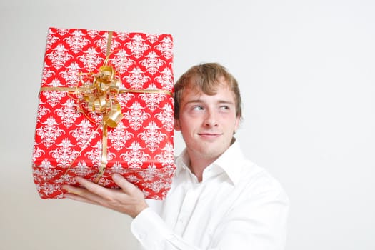 A man trying to guess a present