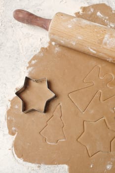 Cookie dough with christmas angles, trees and stars