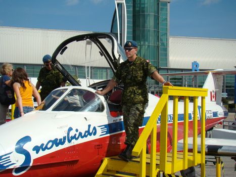 snowbird pilot and plane on display