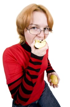 The girl in a red sweater eats an two apples