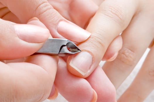 nail salon, manicure applying  - cuticle cut using special scissors