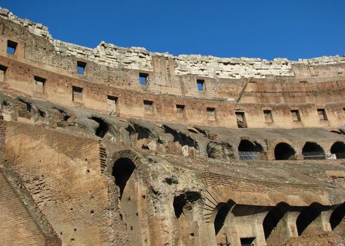 A view of the ancient Rome Coliseum from the inside.
