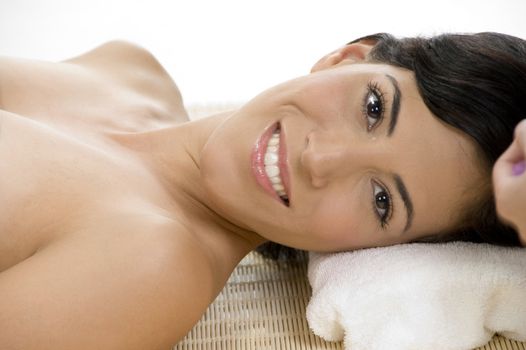 lady relaxing on mat on an isolated background