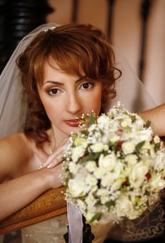 Portrait of the beautiful bride with a bouquet