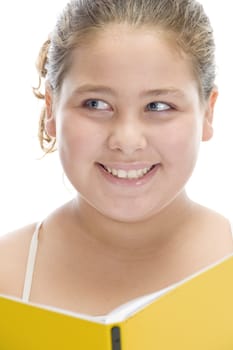 smiling girl with book looking askance on an isolated white background