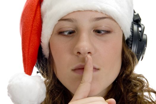 woman instructing to keep silent and looking squint on an isolated white background