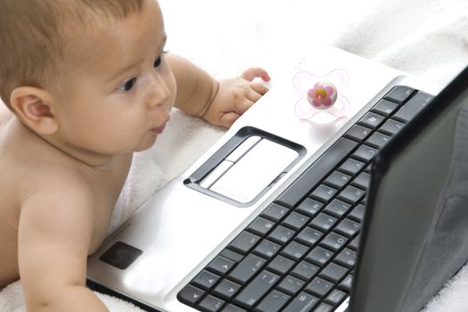 baby with laptop isolated on white background