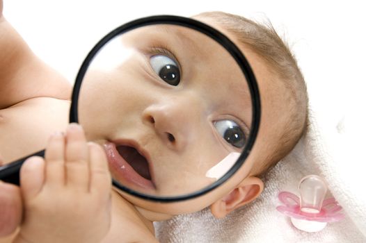 baby's magnified face isolated on white background