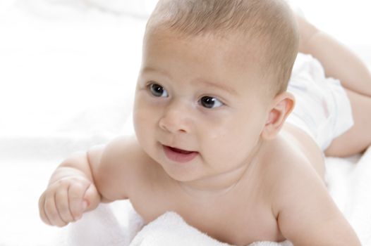 cute newborn baby boy lying with facial expressions