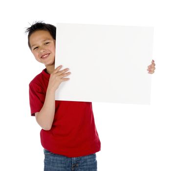 a young boy with a sign