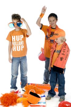 three sad supporters from the dutch football team because they lose the game