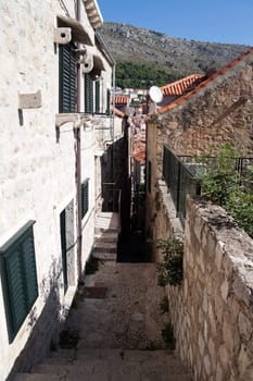 An old stairway leading down a alleyway