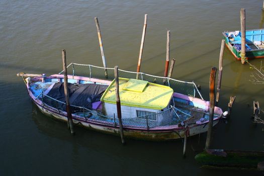 really funny and little boat parked in a river