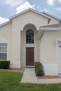 A front exterior of a Florida home, entering in through the door.