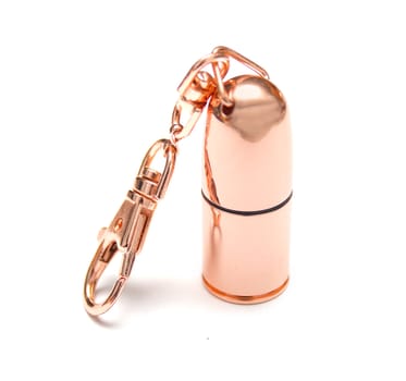 Bright copper charm for keys. Isolation on the white. Shallow DOF