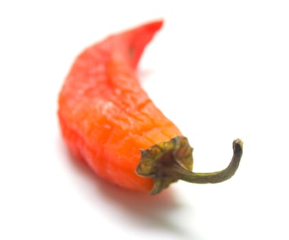 Red pepper on a white background. Isolation, shallow DOF